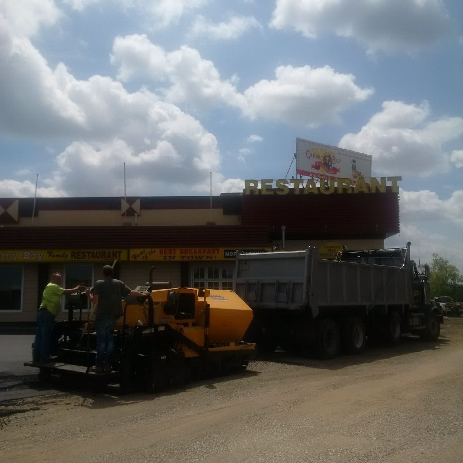 A truck is parked on the side of the road.