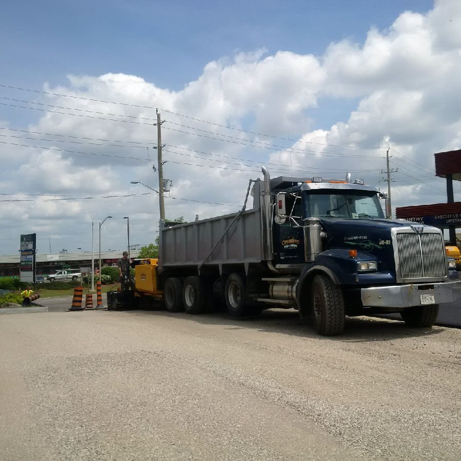 A large truck is parked on the side of the road.